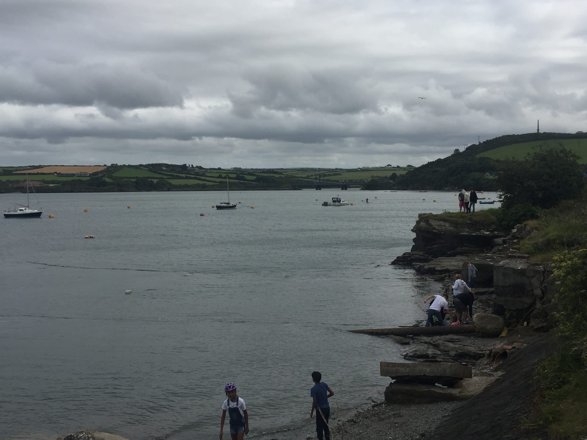 Swimmers and boats in Padstow harbor