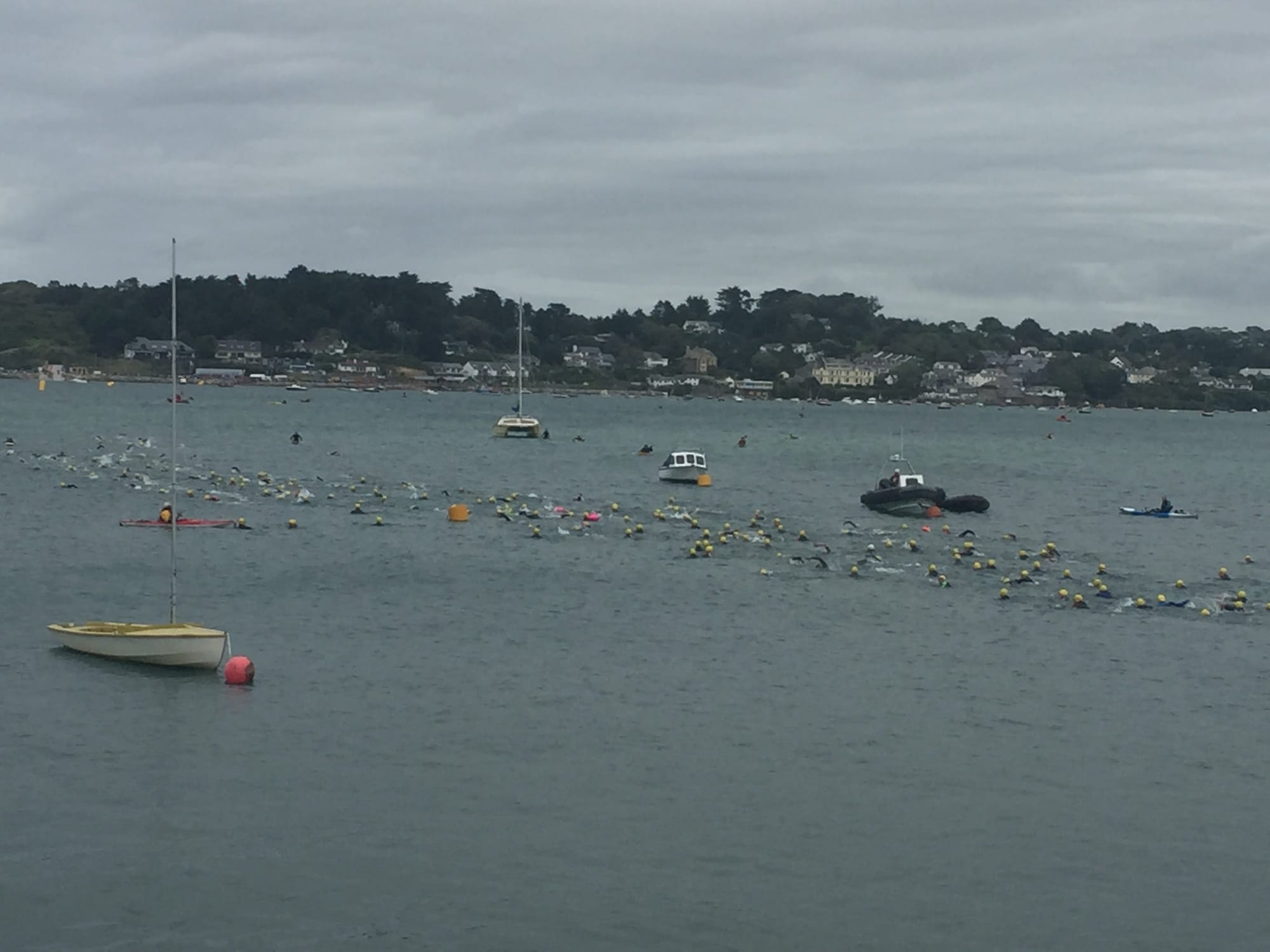 Swimmers and boats in Padstow harbor