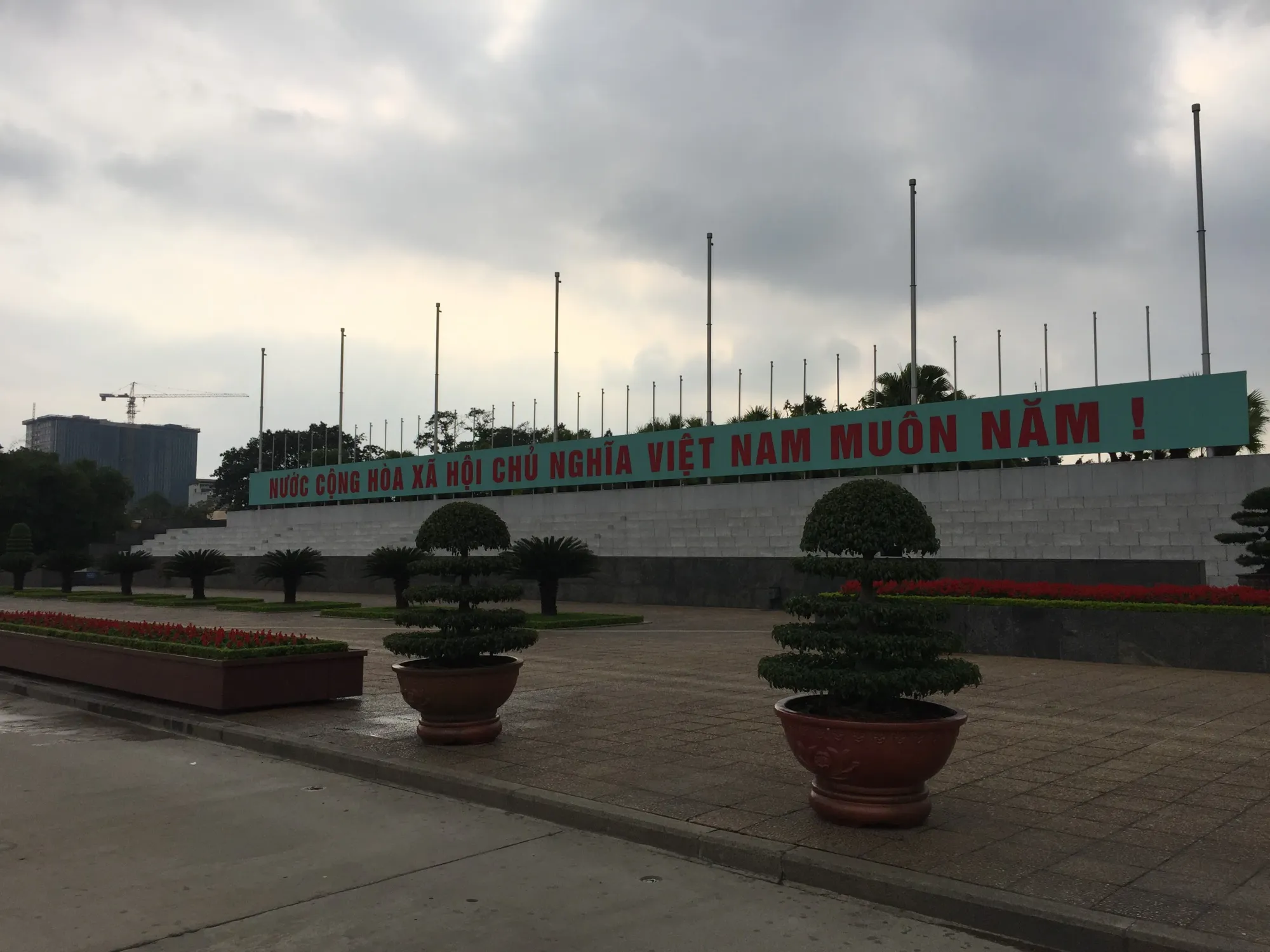 Vietnamese flag square with red banner and tall poles