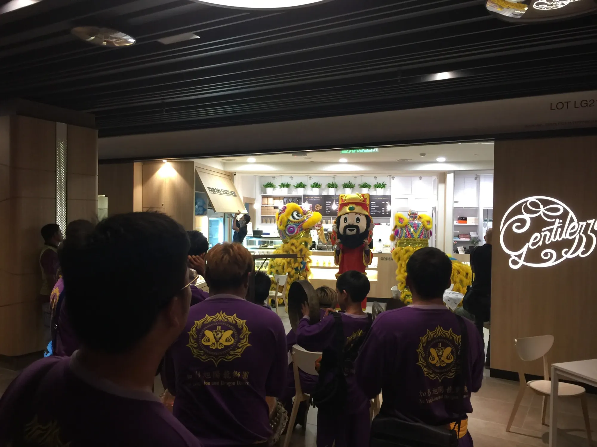 Group of children watching costumed characters in store