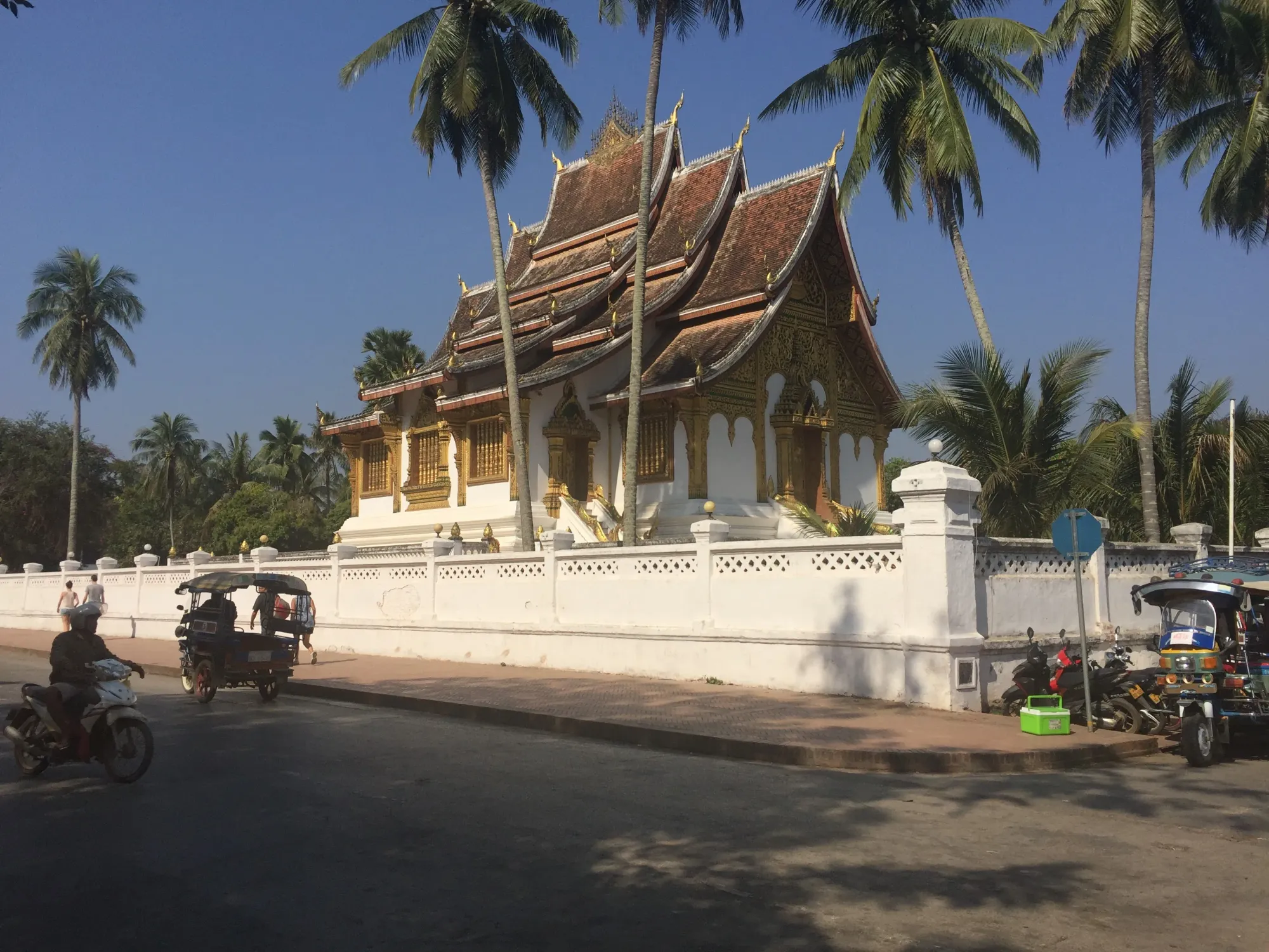 Traditional Thai temple with golden roof and white walls