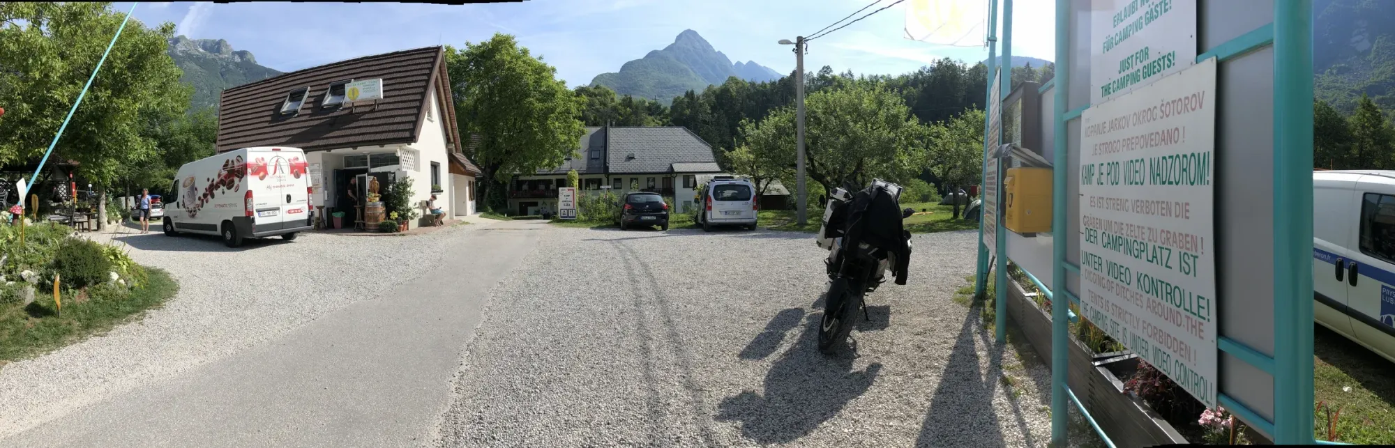 Morning at the Bovec campsite — bike loaded, Julian Alps waking up. Taken at 07:33 local.