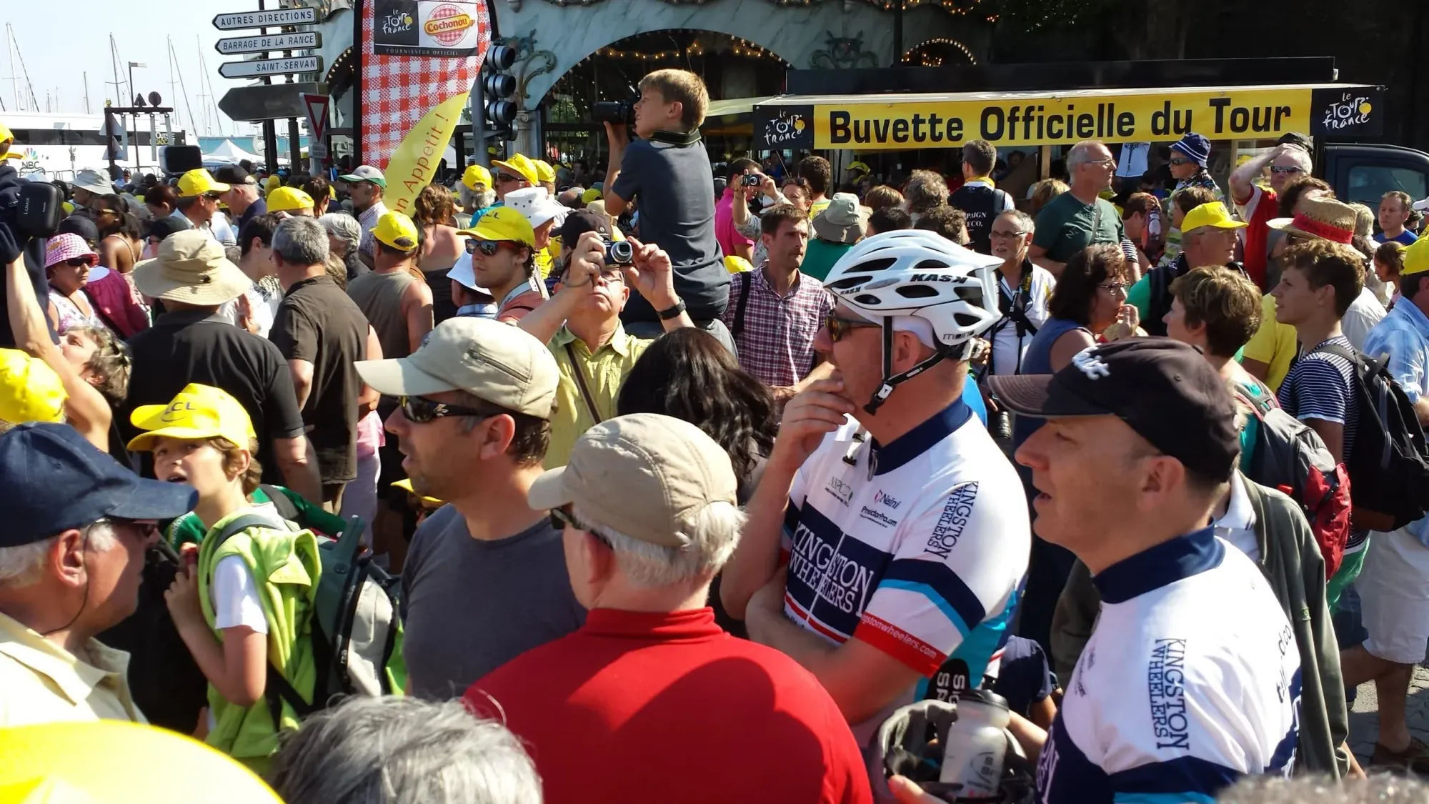 Cyclists surrounded by Tour de France spectators and fans