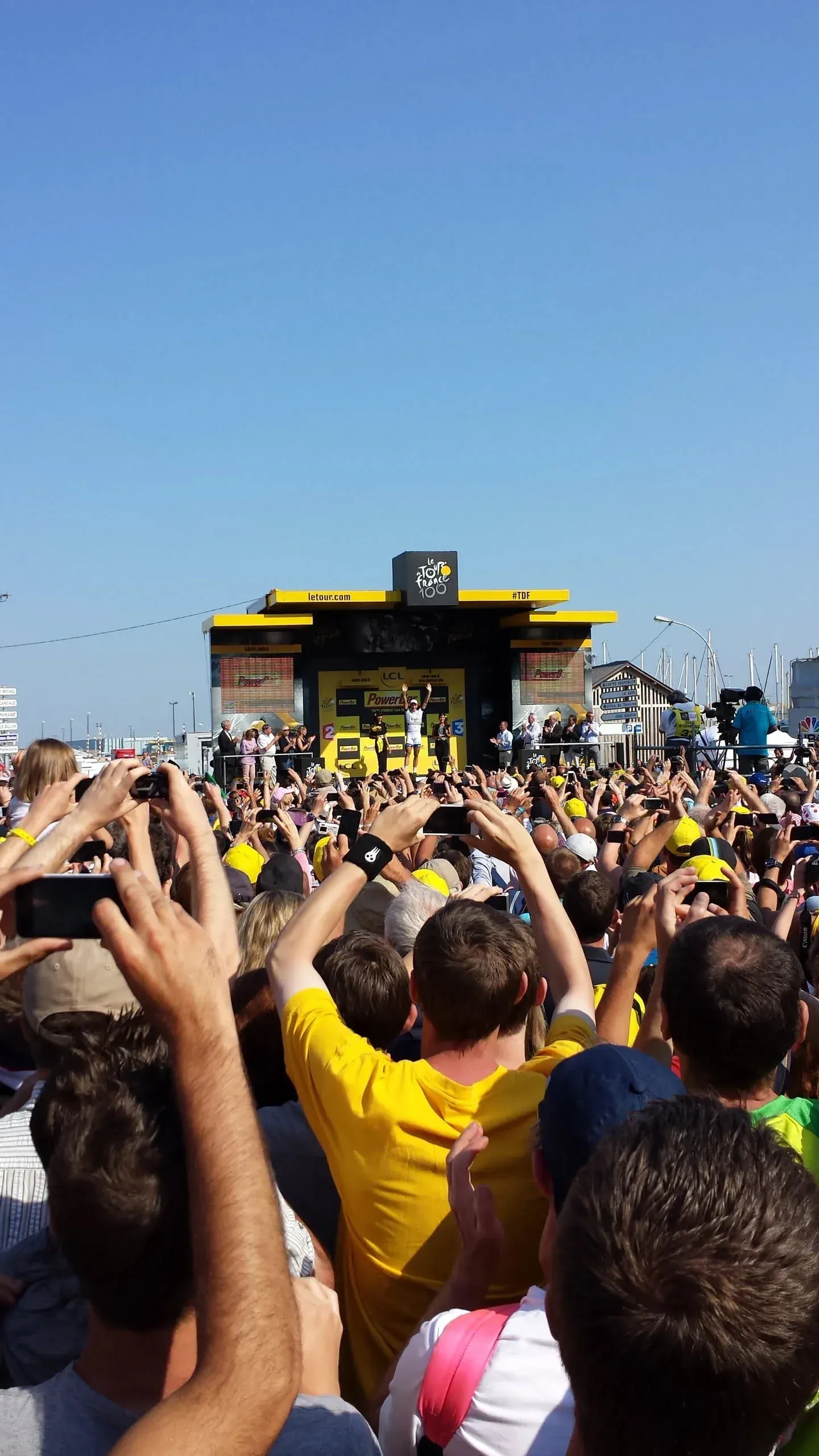Crowds celebrating Tour de France cyclist on stage