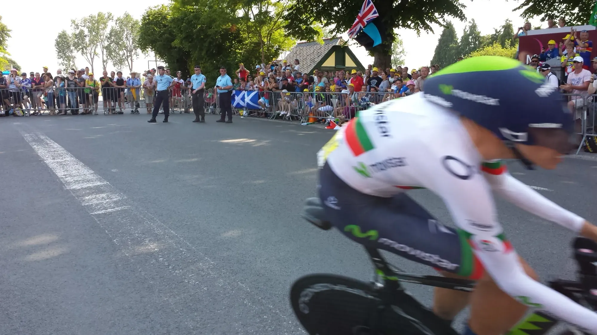 Cyclist speeding past crowds at Mont-Saint-Michel