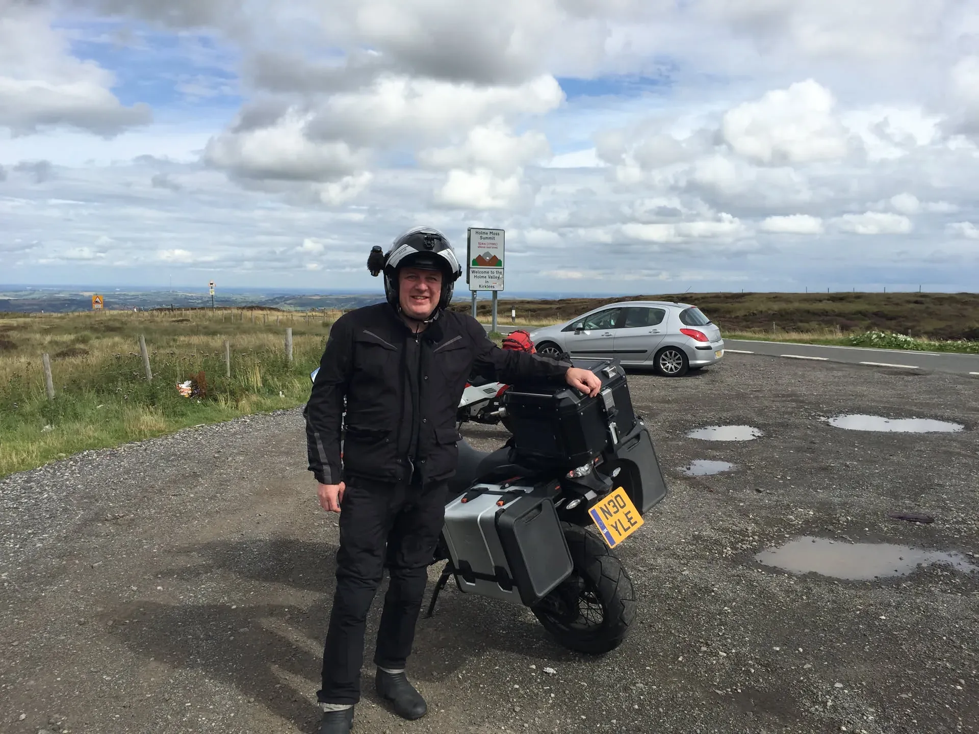 Motorcyclist posing at Holme Valley, England