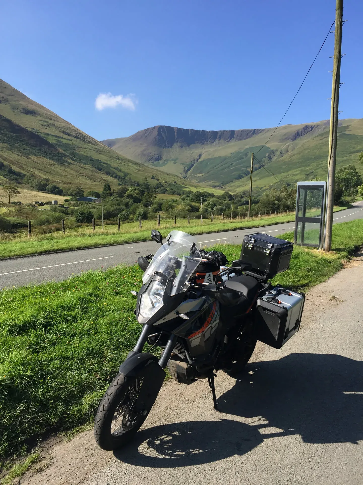 Adventure motorcycle parked in Mawddwy, Wales valley