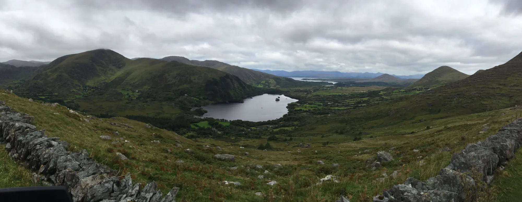 Lake nestled between green hills, Coolcreen