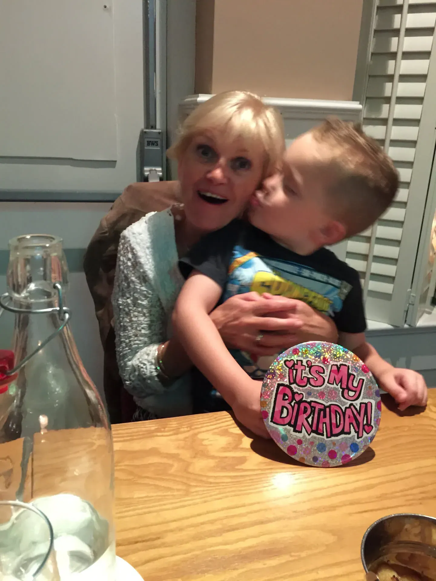 Woman and young boy at birthday celebration, Downings