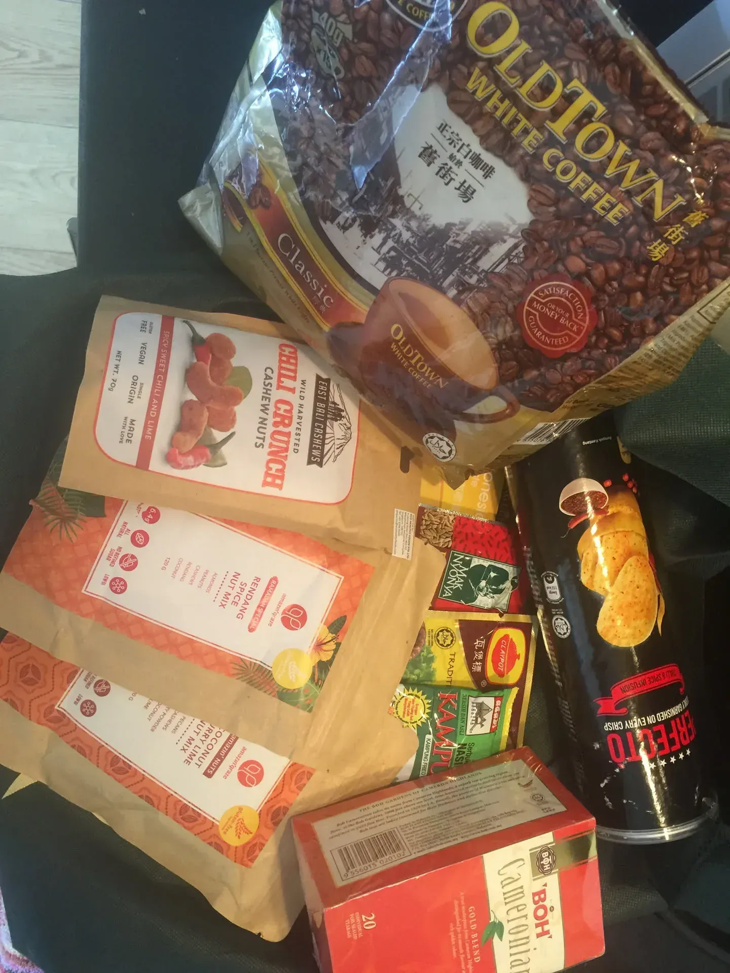 Groceries and snacks laid out on wooden surface