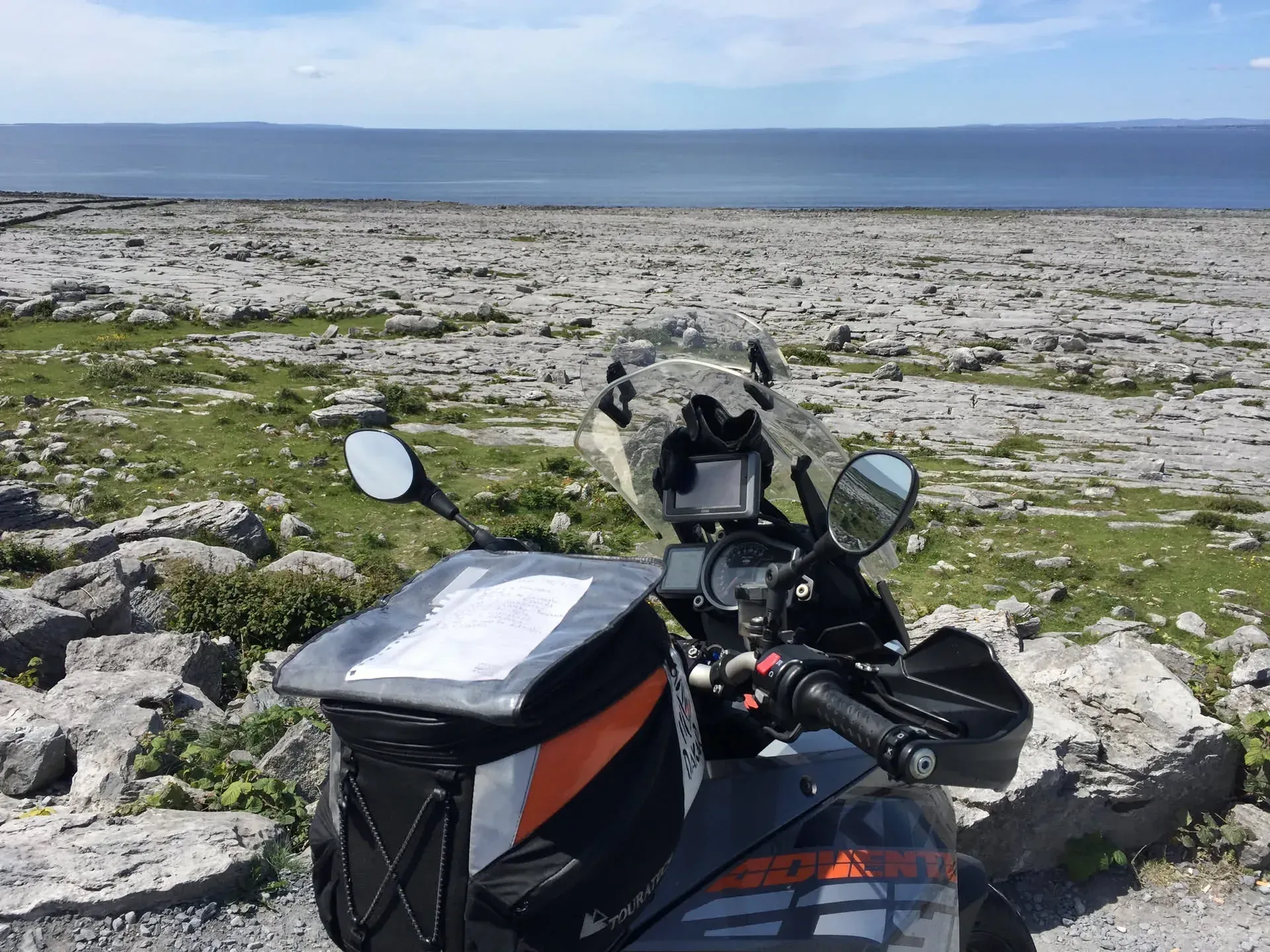 Motorcycle parked at Gleninagh, Ireland coastline view