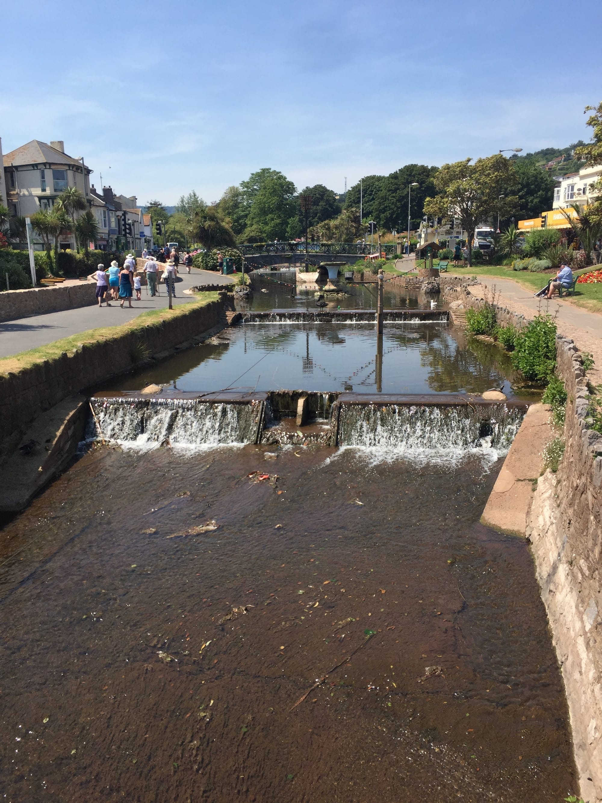 Weirs and pedestrian bridge over Dawlish Water