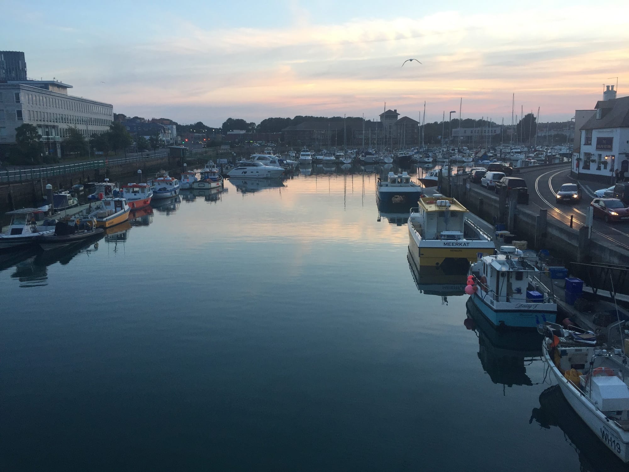 Sunrise at Weymouth harbor, Dorset, with moored boats