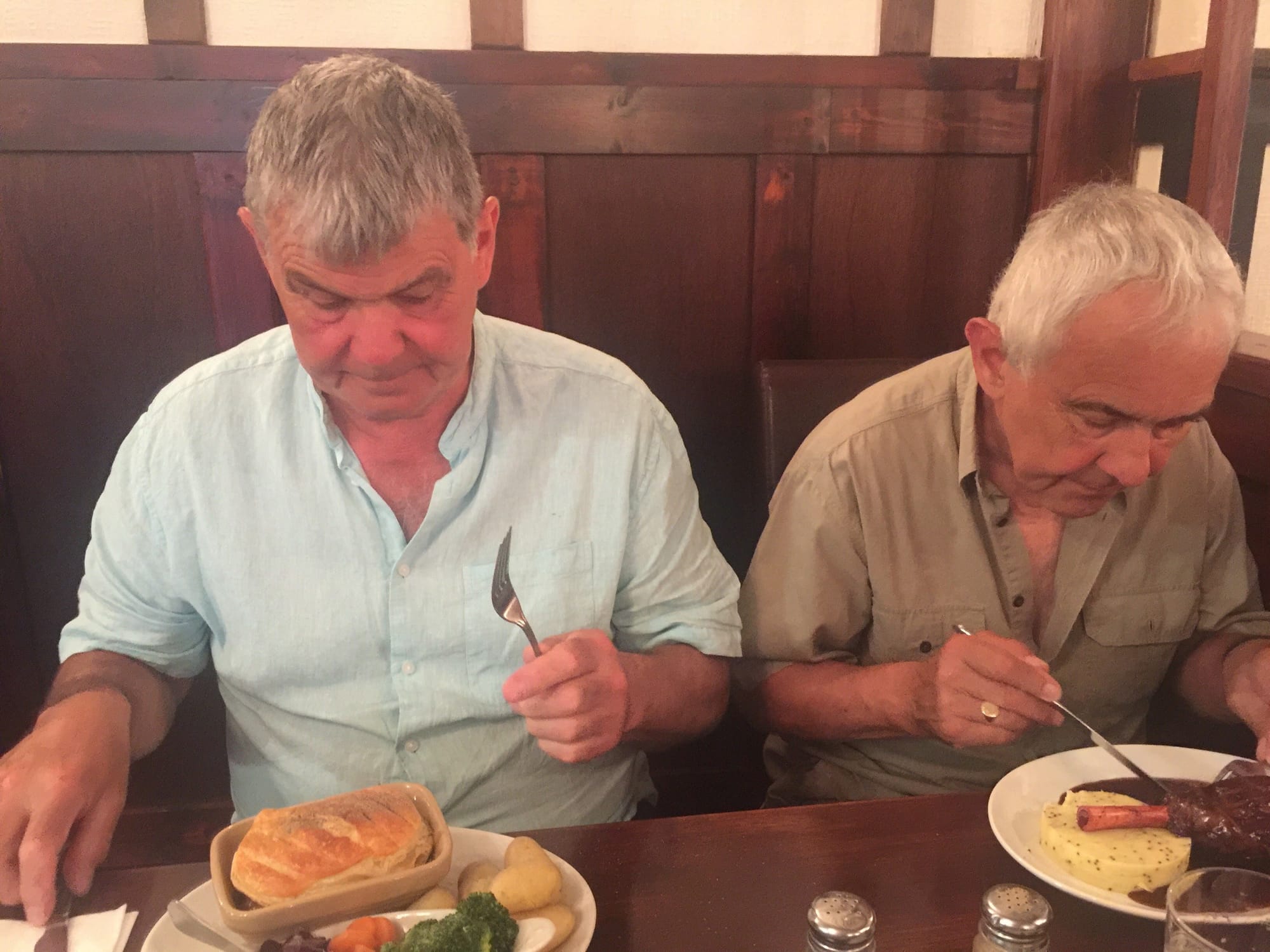 Two men dining at Alcombe, England