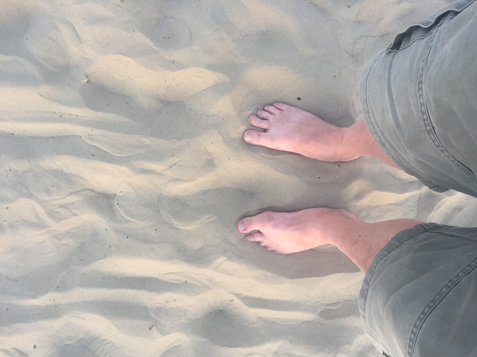 Bare feet in sand at Melcombe Regis beach