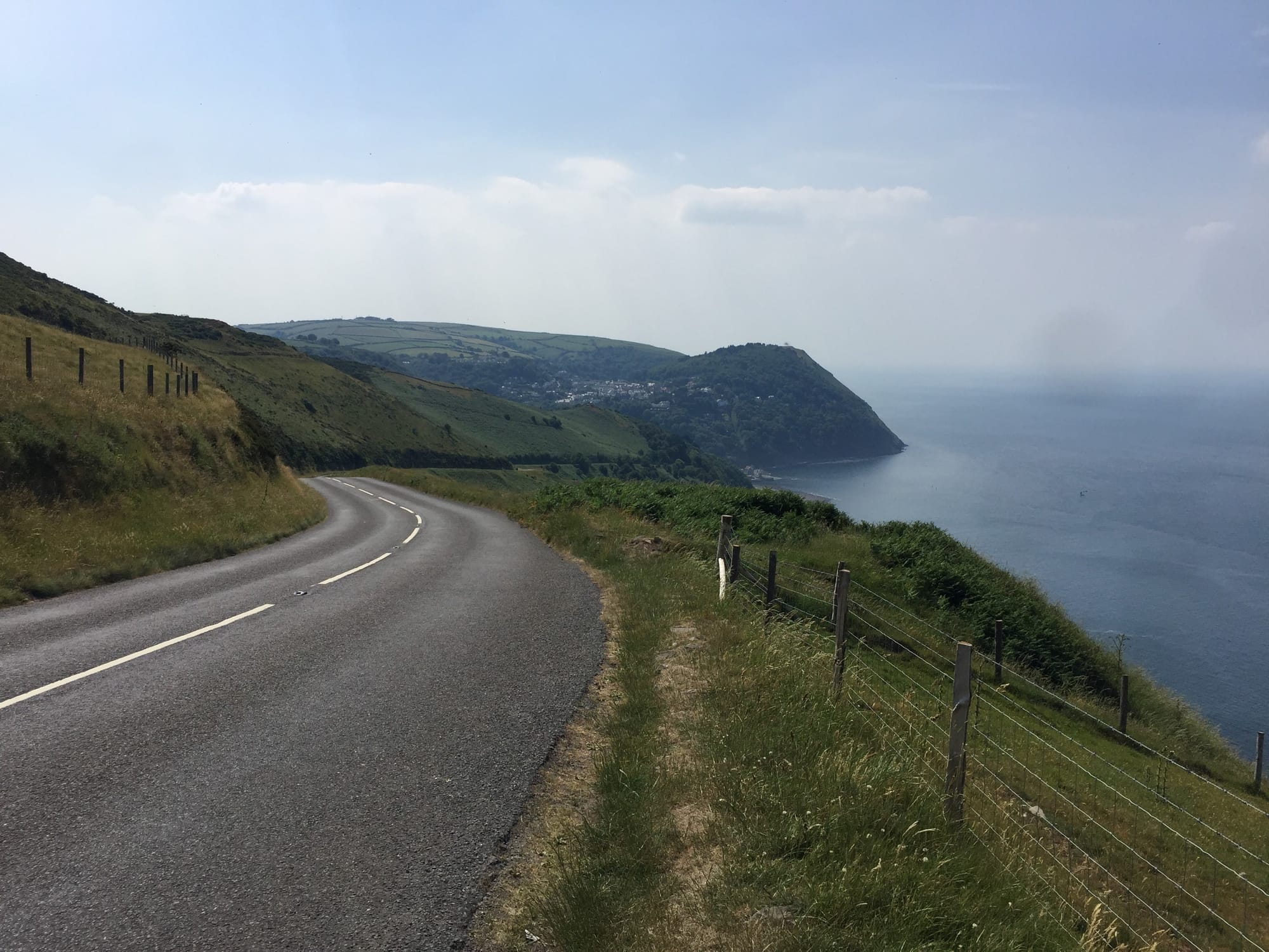 Coastal road curves past cliffs near Lynton